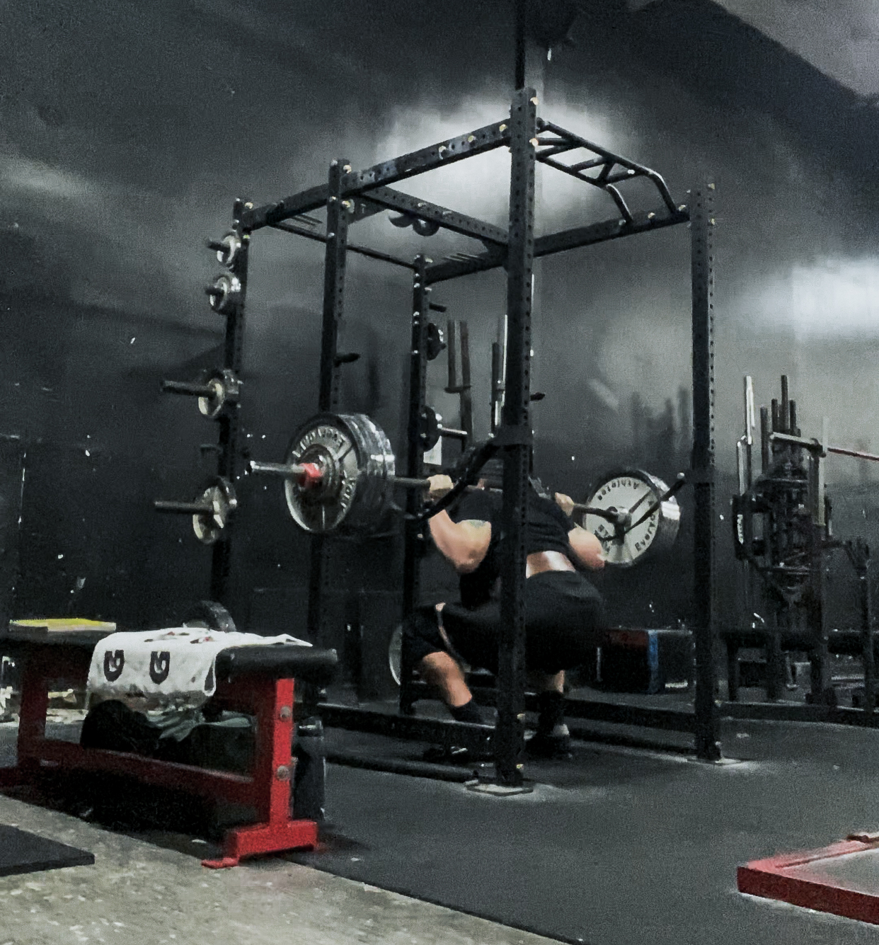 Fat guy doing a back squat